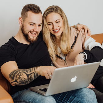 Stock Photo of Couple Using Laptop